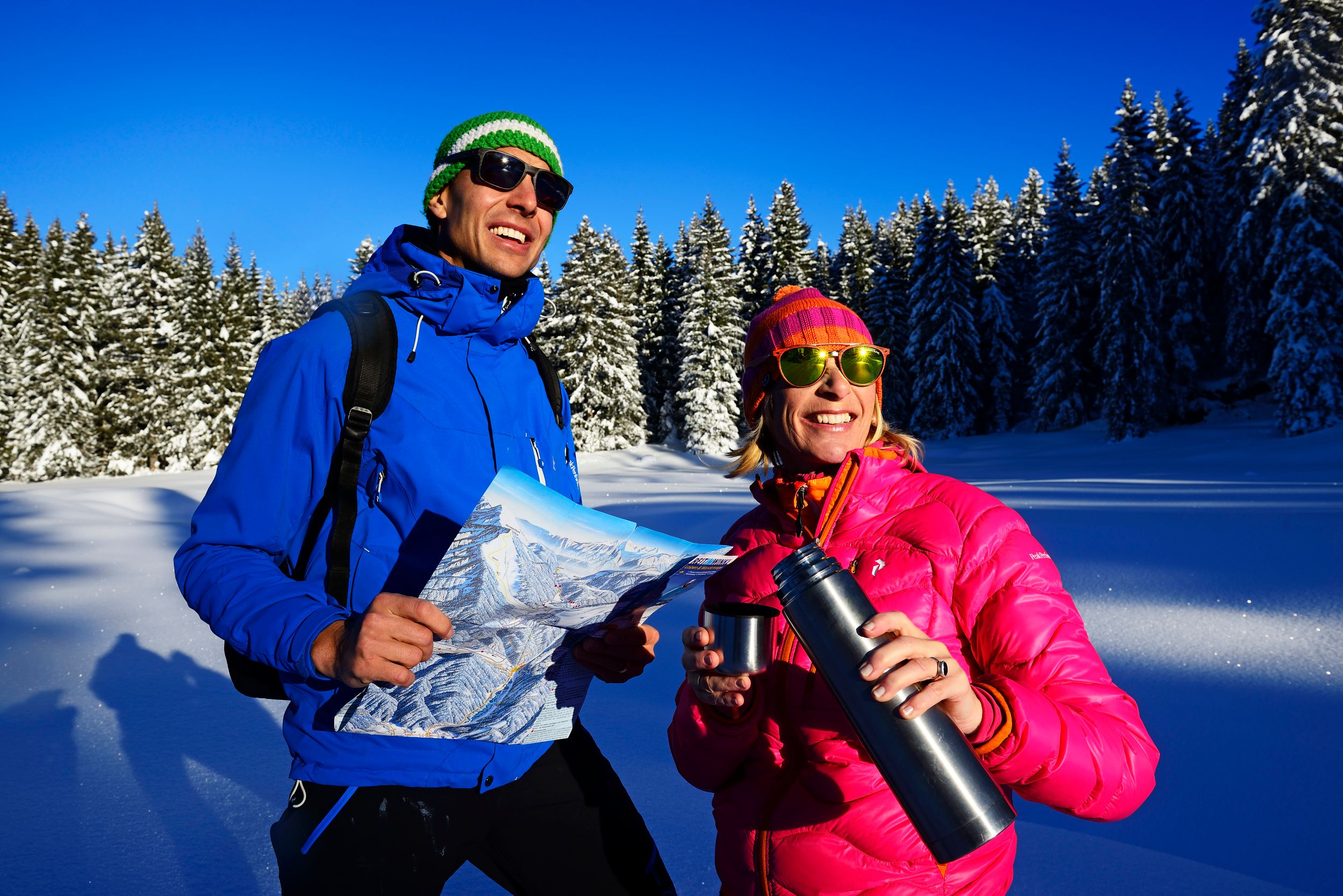 Couple on winter hiking trail panorama